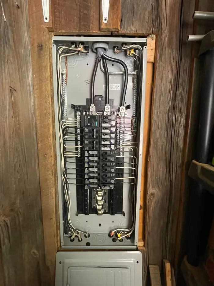 Breaker panel with the dead front removed and the branch circuits run and terminated